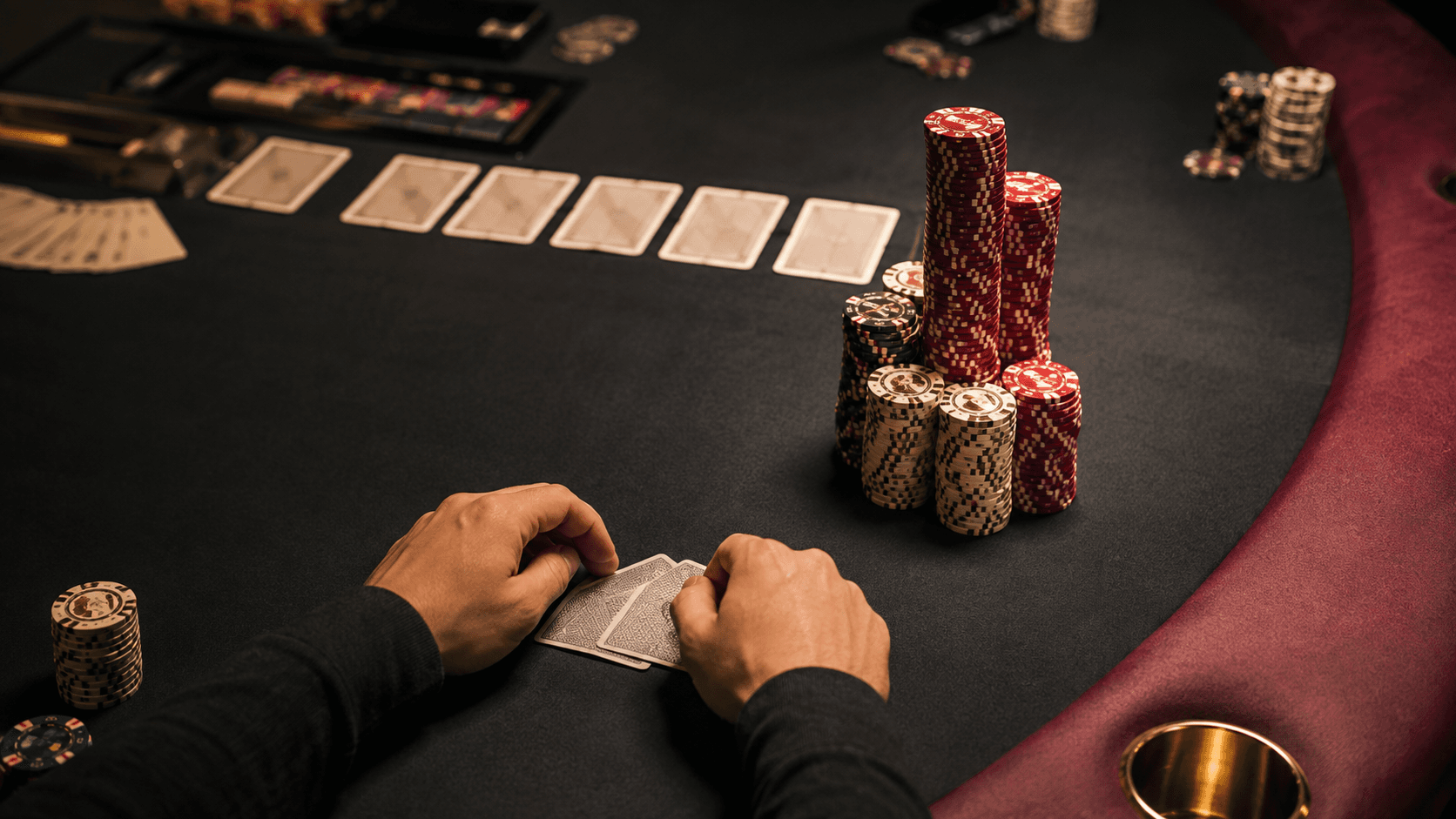 A poker player studies a large river overbet on a live tournament table